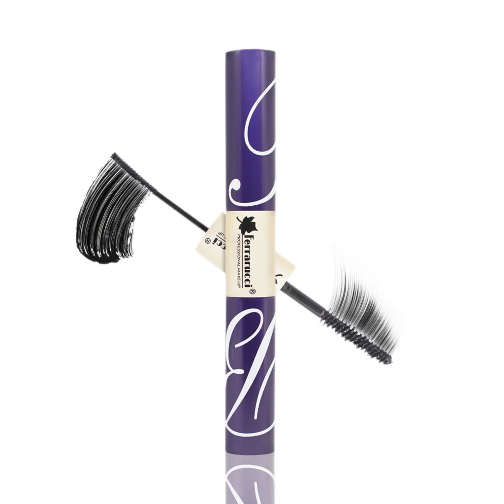Model applying Ferrarucci mascara showing lifted, voluminous lashes with bold black finish